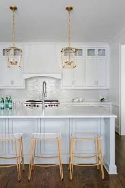 mini brass lanterns over light blue