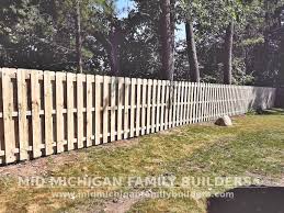 The pickets on one side of the rails span the gaps between the pickets on the other side of the rails, blocking the view through the fence. Make That Two Amazing Shadowbox Wooden Fences In The Books Mid Michigan Family Builders Mid Michigan Family Builders