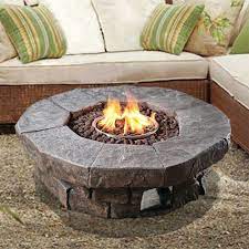 Fire pit bench is a great idea for a social gathering of friends and family. Peaktop Outdoor Round Stone Look Propane Gas Fire Pit Teamson