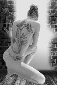 Nude Woman With A Tattoo On Her Back Stock Photo, Picture and Royalty Free  Image. Image 13787579.