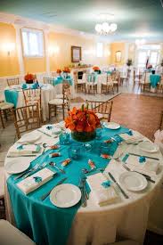 Coral gives a soft and elegant touch while turquoise gives a fun, playful and fresh atmosphere. Aqua Setting Could Add Red And Yellow Flowers Wedding Themes Fall Turquoise Table Teal Table