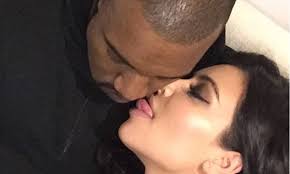 The lick of love! Kim Kardashian showers Kanye West with affection in  awkward selfie... after presenting at the BRIT Awards | Daily Mail Online