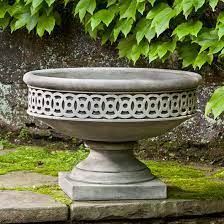 Designed to weather naturally and last a lifetime. Canora Grey Williamsburg Cast Stone Urn Planter Wayfair