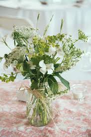 Cheap flower centerpieces for weddings. 5 Attainable Ways To Style Your Wedding Flowers On A Budget Unique Wedding Flowers Affordable Wedding Flowers Wedding Centerpieces