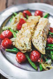Seasoned with garlic, onion and citrus, these fish fillets are moist and tasty, and they look especially pretty on a colorful bed of shredded carrots. Mediterranean Baked Halibut W Veggies Video The Mediterranean Dish