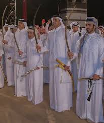 Hh Amir Sheikh Tamim Bin Hamad Al Thani In National Day Celebrations Doha Qatar سمو امير دولة قطر الشيخ تميم بن حمد في رقصة عرضة Academic Dress Doha Fashion