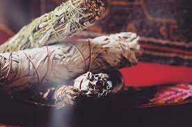 Once you're ready to extinguish a sage smudge stick, press the burning tip firmly into your fireproof vessel, dirt, or sand until the smoke no longer rises. How To Sage Energetically Clear Your Home And Office Vogue