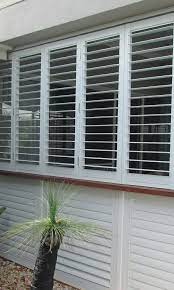 Roller shutters installed to existing home with hopper windows. Aluminium Shutters Dollar Curtains Blinds