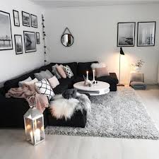 An accent wall made of dark charcoal tiles boldly stands out in this elegant mill valley living room. Black White And Grey Living Room Decor Novocom Top