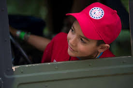 Adrian Ablang sits in a HUMMV driver's seat during