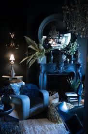 A small, narrow living room painted a deep and glossy shade of blue feels 100% original thanks to alison giese interiors.the interior designer achieved the eclectic look by filling the space with a broad range of furniture and accents in different styles. Interior Decorating With Color Cool Hues Tones Dark Living Rooms Hollywood Regency Living Room Regency Living Room
