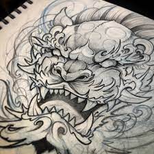The male fu dog can be seen holding a globe under the right paw showing that he no matter what your motivation for a foo dog tattoo is, the one thing you can be sure of is that it is a tattoo design that is good looking and full of. Pin By Edwin Roman On Tattoo Foo Dog Tattoo Design Foo Dog Tattoo Japanese Tattoo Designs