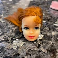 Removing green ear from vintage doll?