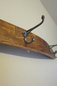 The wine barrel stave coat rack securely anchors to the wall on both ends and gracefully arches away in the center. Wine Barrel Stave Coat Rack Instructables