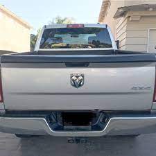 A stock dodge pickup tailgate is hinged and features a handle. 10 21 Dodge Ram Tailgate Protector