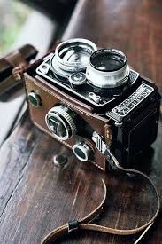Rolleiflex Vintage Film Camera With A Leather Strap It Looks So Intricate For Such An Old Camera Vintage Cameras Antique Cameras Vintage Camera