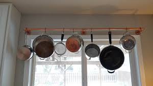 If you don't have the cupboard space and don't want to hang your pots and pans overhead, the island is a good solution. Projects Artisallaroundus
