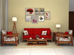 Modern living room design with sofa and wooden lamp. Give A Modern And Colourful Look To Your Living Space With This Floral Print Cona Wooden Sofa Designs Living Room Sofa Design Wooden Living Room Furniture
