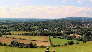Children running at hindhead commons and the devils punchbowl. The Surrey Hills Area Of Outstanding Natural Beauty Aonb Towns Villages In Surrey Visit Surrey