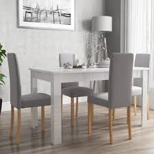 White is an easy colour to match, and looks especially good with modern, glossy dining sets, as well as more classic, rustic looks such as a wooden farmhouse table. Vivienne Extendable White High Gloss Dining Table 4 Grey Fabric Chairs Buyitdirect Ie