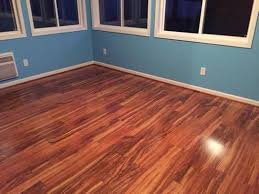 Pergo Xp Hawaiian Curly Koa 10 Mm T X 4 87 In W X 47 87 In L Laminate Flooring 13 1 Sq Ft Case Lf000340 The Home Depot Inexpensive Flooring Flooring Floor Colors