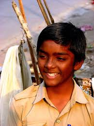 Young Boy Works Hard As Porter, India Editorial Stock Image