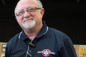 Peter Gooley is standing