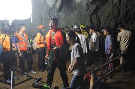 Rescue personnel walk in a cave at the tham luang cave complex in a picture tweeted by elon musk who arrived at the caves with onlookers watch and cheer as a helicopter flies towards an airstrip near tham luang nang non cave to transport the fifth boy. 12 Feared Trapped In Mae Sai Cave Search Underway