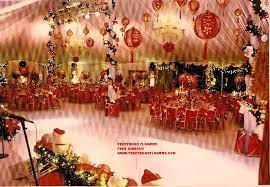 A few glass candle holders filled with berries and candles can look great hanging on snow covered fir branches. A Christmas Party For A Famous Celebrity Decorated By Fred Gibbons Party Tent Christmas Party Panda Party