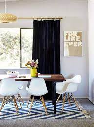 Break Up Beige With These 11 Tips To Style Rugs Over Carpet Dining Room Rug Carpet Dining Room Dining Room Design