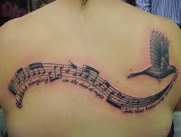 Guitar and music notes tattoo. 35 Awesome Music Tattoos For Creative Juice