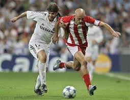 Werder bremen's goalkeeper christian vander dives in vain for the ball while olympiacos' midfielder predrag djordjevic and weder bremen's serbian. Real Madrid Player Pablo Garca From Uruguay Duels For The Ball With Olympiakos Player Predrag Djordjevic Right During Their Group F Uefa Champions League Soccer Match At The Santiago Bernabeu Stadium In