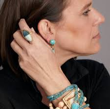 Ring featuring petrified opalized wood, 18k yellow gold.