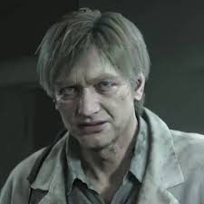 A man with glasses and a white shirt is looking at something