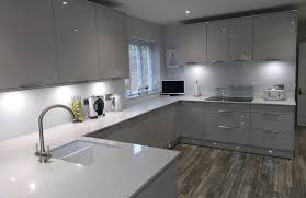 This kitchens international callerton valencia kitchen in high gloss white is a very sleek galley kitchen with maximum storage. Nevada Light Grey Real Kitchens Stunning Kitchens Designed By Experts Sigma 3