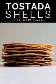 Tostadas baked on the rack are on the left and baked on a pan on the right. I Ll Show You How To Make Perfectly Crisp Homemade Tostada Shells With One Of The Simplest Recipes You Can Imagine Using Tostadas Mexican Food Recipes Recipes