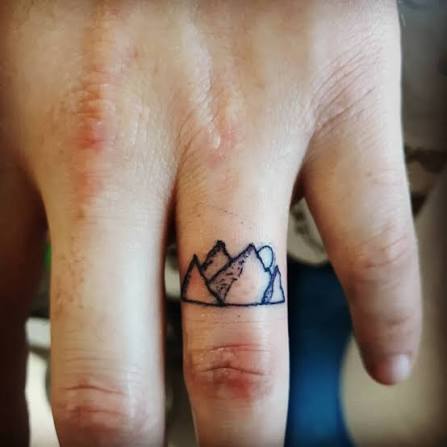 Cool little mountain range on the finger I got to tattoo the other day. #fingertattoo #mountains #ringfingertattoo
