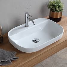 oval white ceramic drop in sink