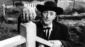 A stranger is caught cheating in a game of five card stud in a rincon, colorado saloon in 1880. Robert Mitchum Movie Reviews Film Summaries Roger Ebert