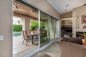 In the outdoor living room of a malibu house designed by todd nickey and amy kehoe, a vintage sofa and coffee table mix with janus et cie chairs. Springtime Indoor Outdoor Living California Windows And Doorscalifornia Windows And Doors