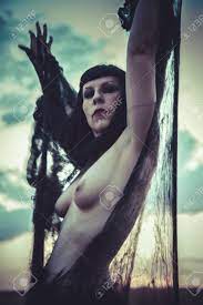Gothic Beauty At Sunset, Naked Brunette Woman Stock Photo, Picture And  Royalty Free Image. Image 28950565.