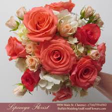 Find the right flowers for your spring wedding in this gorgeous collection of bridal bouquets and floral centerpieces. Coral Wedding Bouquet Buffalo Wedding Event Flowers By Lipinoga Florist