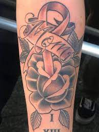 Breast cancer ribbon with flowers tattoos. 25 Meaningful Ribbon Tattoo Designs For Beautiful Women