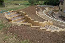 Tips To Build Terraced Retaining Wall On Slope Ceramic Furniture Woodworkingplans Landscaping Retaining Walls Garden Stairs Sloped Backyard