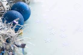 99% of the time with coastal decor, we are already using seafoam greens and teal blues…. White Christmas Ornaments On Light Blue Background With Colorful Stock Photo Picture And Royalty Free Image Image 89468097