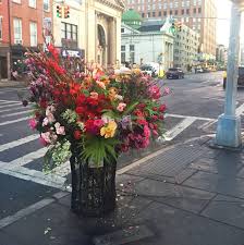 Potted hanging flowers on porch on danforth street. Lewis Miller S Flower Bombs Pretty Flowers Flower Installation Flowers