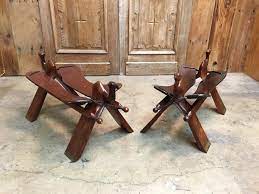 Camels have long been domesticated and, as livestock, they provide food (milk and meat) and textiles (fiber and felt from hair). Rosewood And Leather Camel Saddle Stools For Sale At 1stdibs