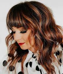 The shorter layers cut around the face allow the natural wave and movement of the hair to add plenty of body and prevent the style from looking boring. 30 Best Styles For Medium Length Hair With Bangs Hair Adviser
