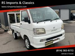 Image result for Shooting White 1964 Daihatsu