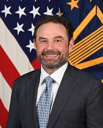 Dustin J. Gard-Weiss > U.S. Department of Defense > Biography